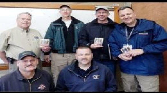 news men give devotional books to first responders following mudslide 0