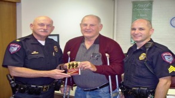 news men present books to first responders 0